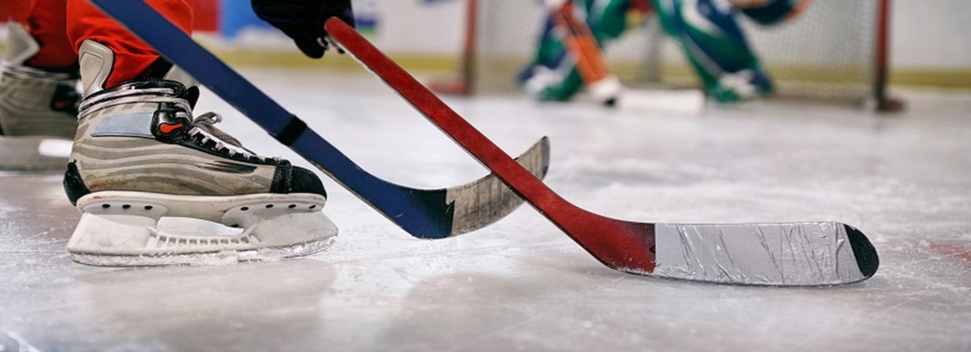 image of skates and hockey sticks